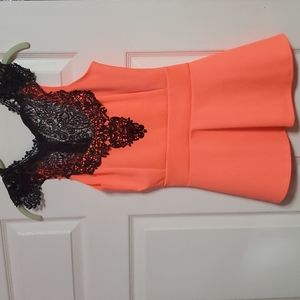 Orange fit and flair top. Has a tied bow in the back